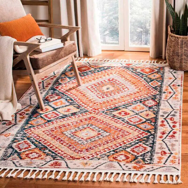 red orange and blue color bohemian rug with tassel in the living room