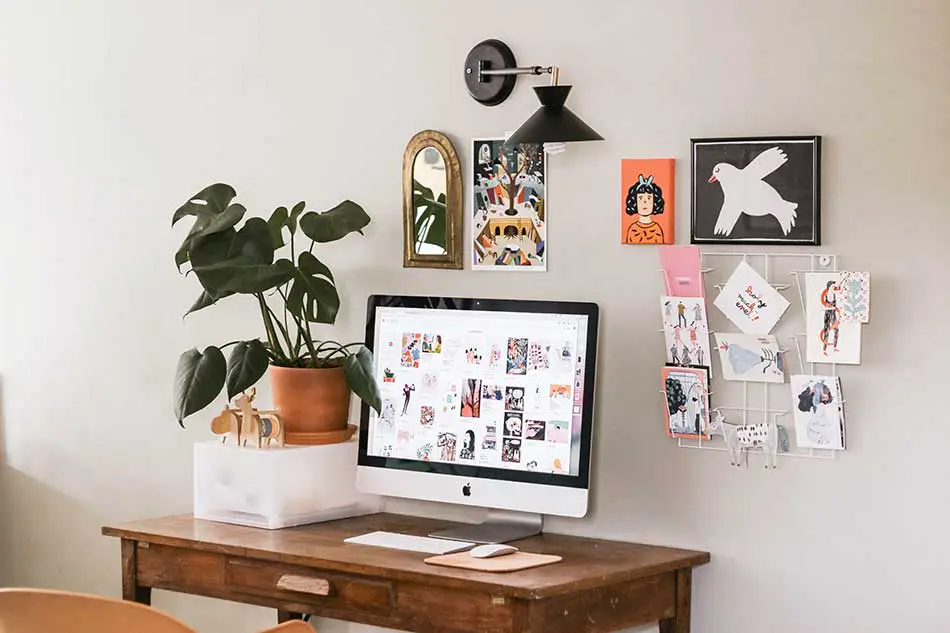 Wall art and pictures behind the desk.