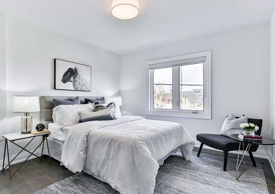 Feng shui bedroom layout with white wall and bed color