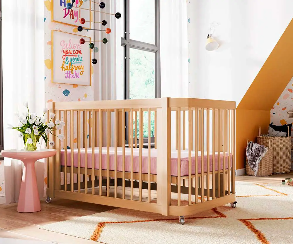 Crib in pink yellow bedroom
